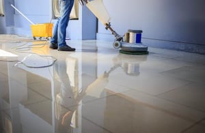 When And How To Buff Your Commercial Floors worker buffing commercial floor