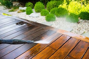 Refinishing Decks on an Industrial Level power washing wooden deck