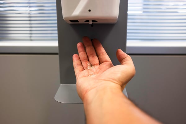 male-hand-using-automatic-soap-dispenser-cleaning-hands-office-hospital-sanitize-virus-bacteria-infection-prevention-concept-main-focus-palm-hand