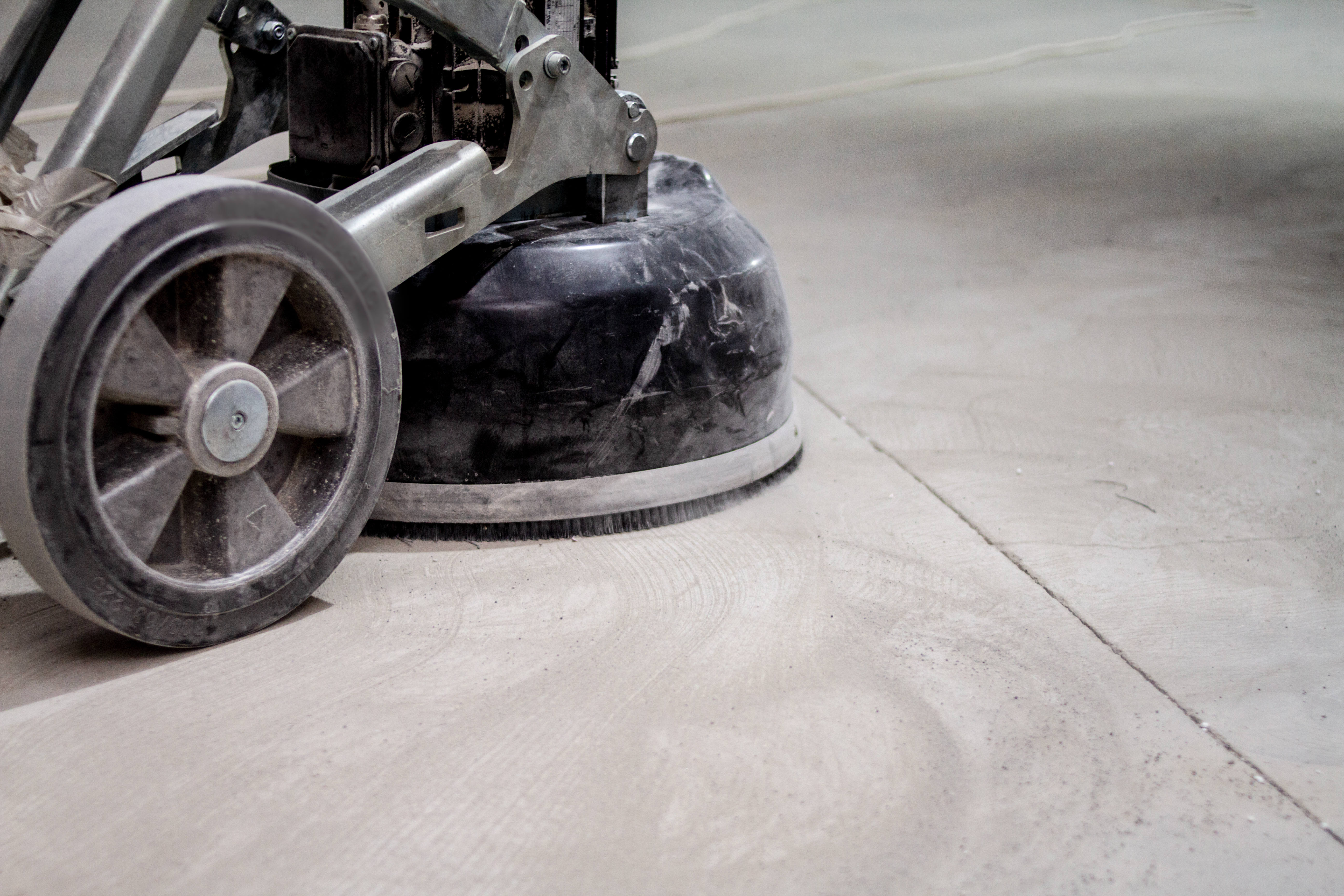 Surface Prep: How Industrial Concrete Grinders Enhance Coating Adhesion